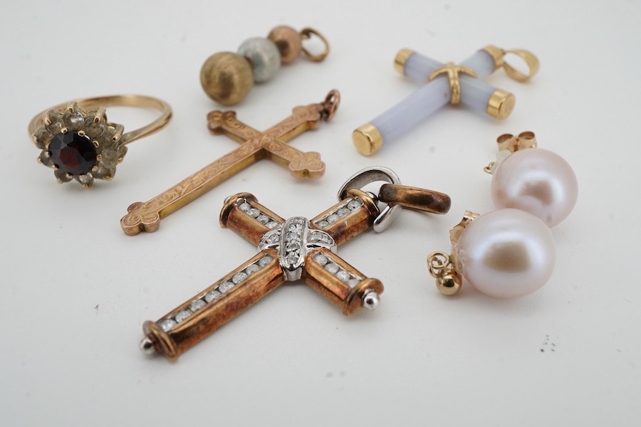 A collection of jewels, comprising: a diamond cross pendant in bicoloured 9ct gold, length 4.5cm, British hallmarks; an early 20th century gold cross pendant with foliate engraving, stamped B&S 9CT; a pale lavender jadei